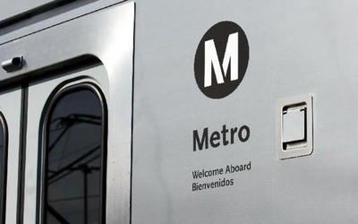 Close up of Metro logo on subway