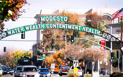 City of Modesto sign arching over a city street