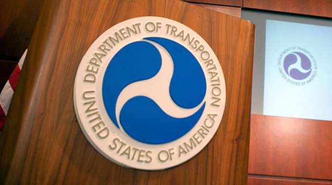 A close up picture of the United States Department of Transportation logo on a podium.